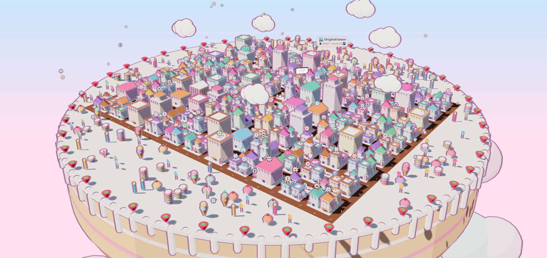 The CandyCity 3D town on a giant cake, with candies on the rooftops